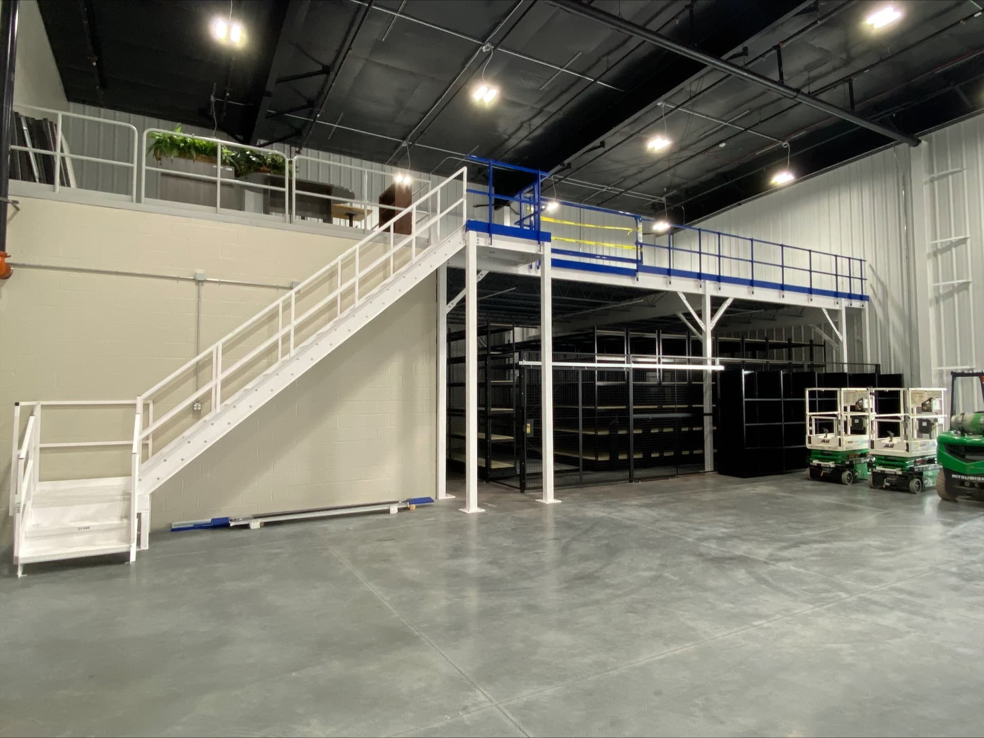 Steel mezzanine platform with high-density shelving underneath