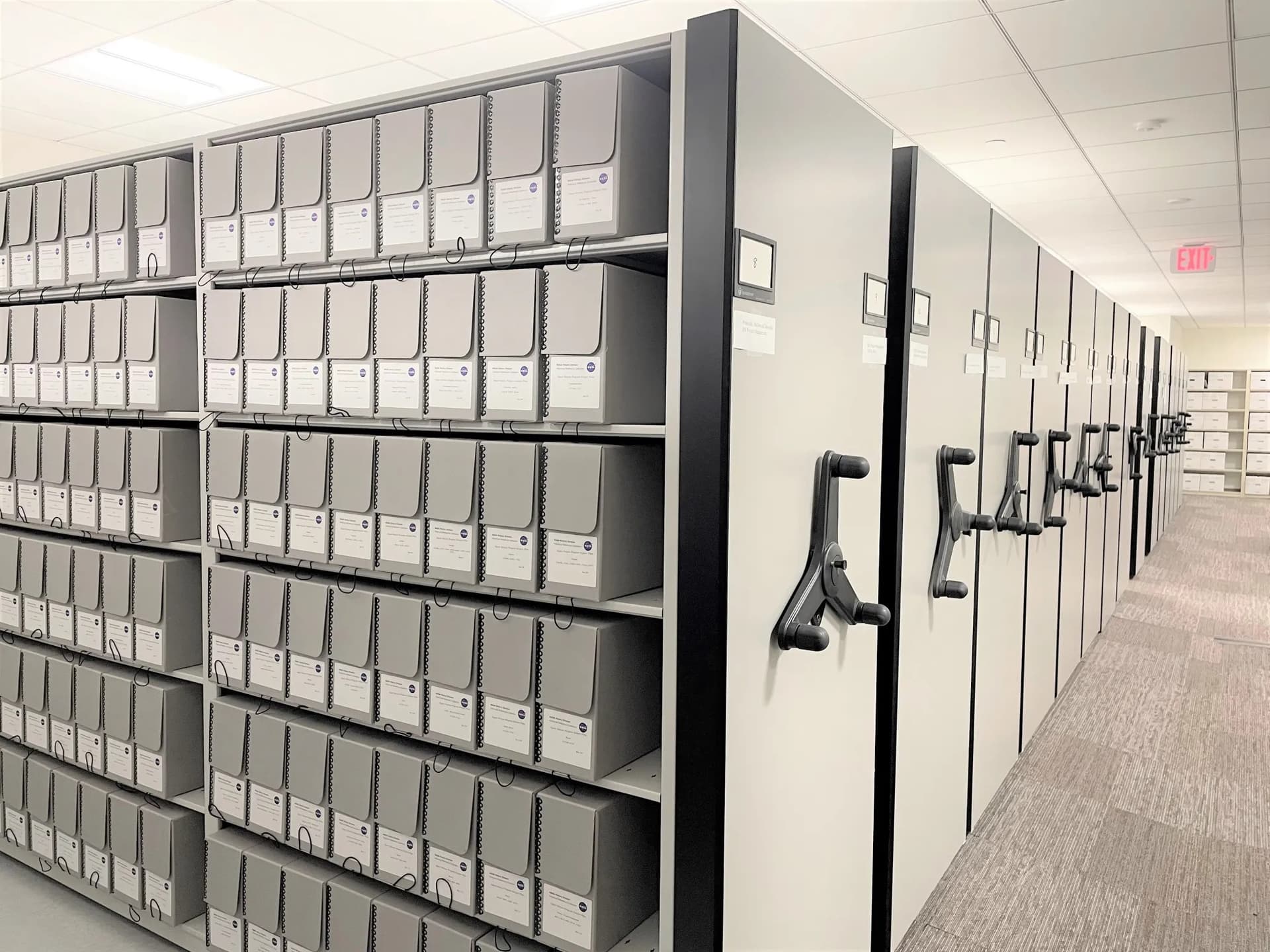 High-density mobile shelving system storing indexed records boxes
