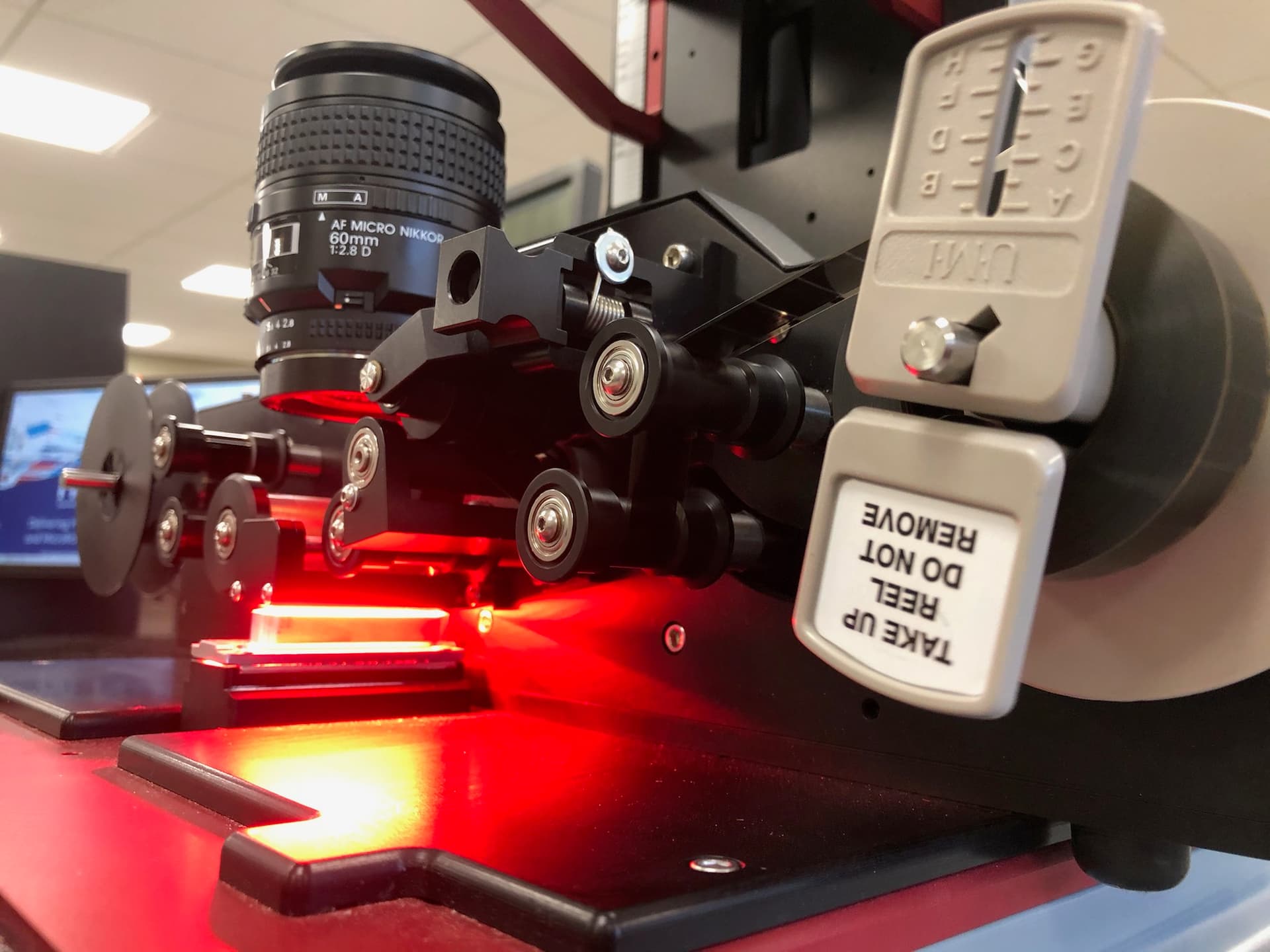 NextScan microfilm scanner in operation with red illumination