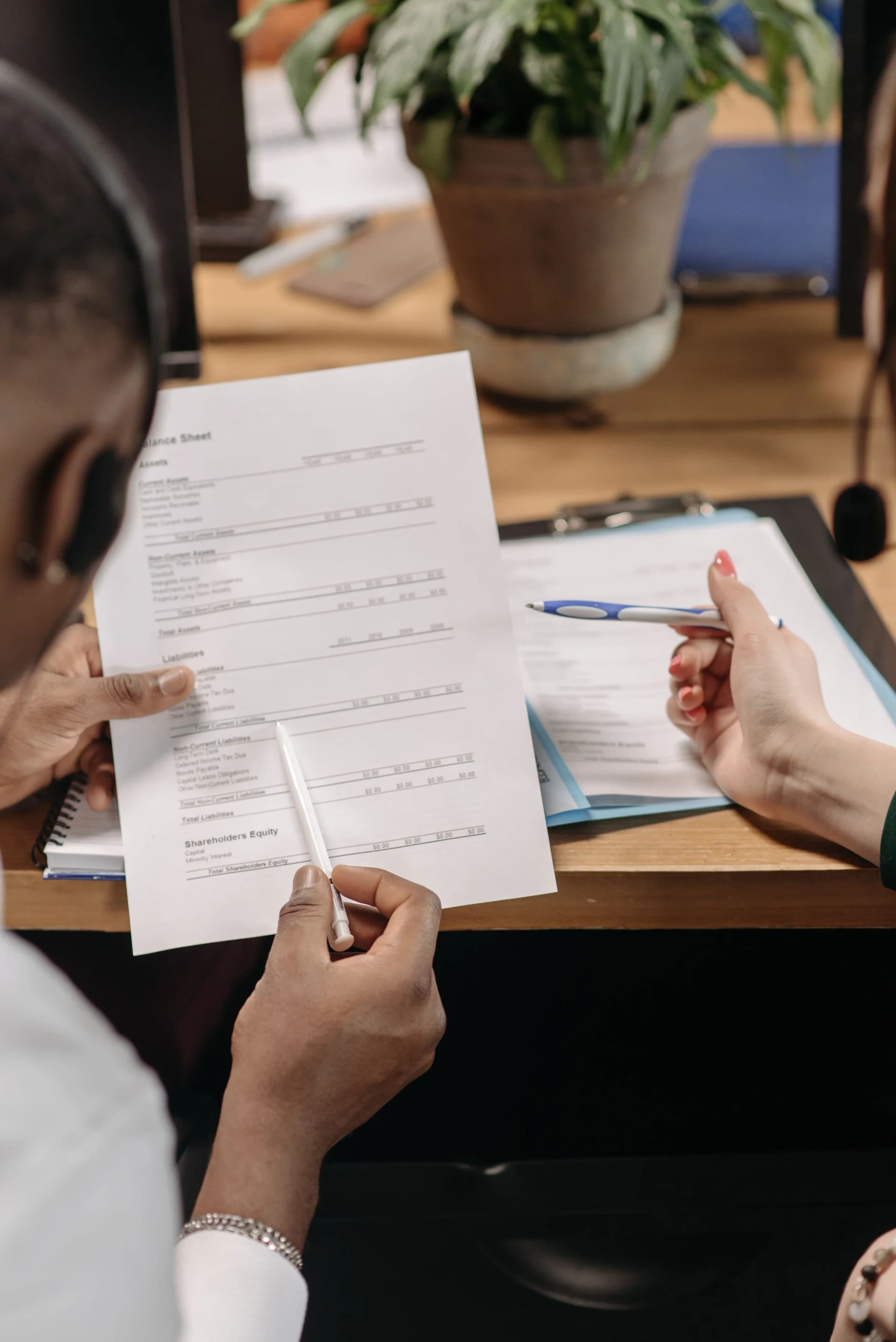Operations staff reviewing controlled business records and compliance documentation