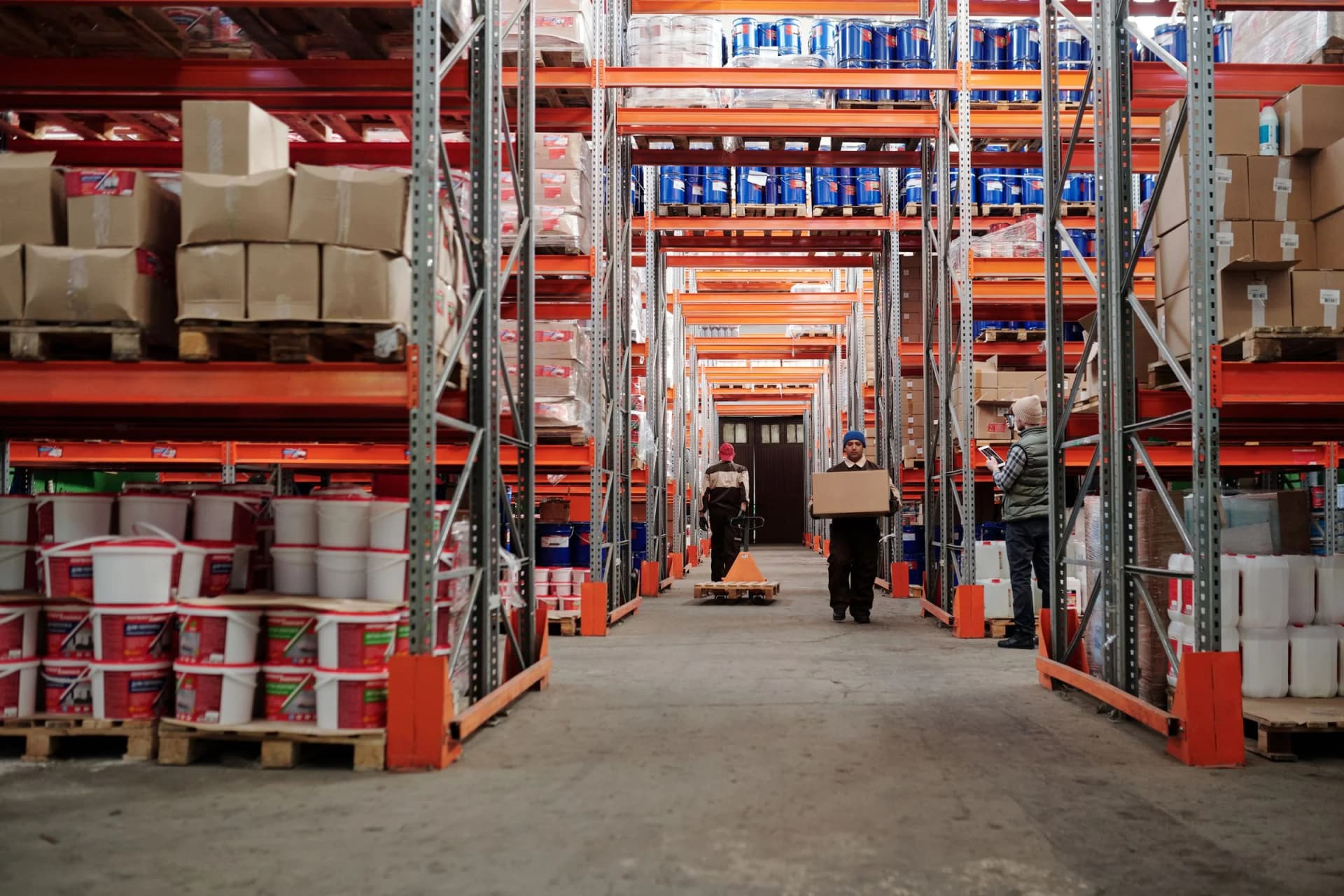 Warehouse team working across an organized industrial storage operation